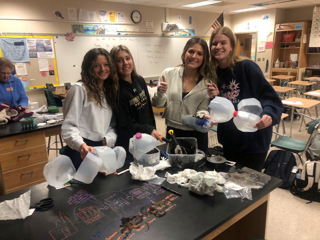 Students sowing seeds at workshop